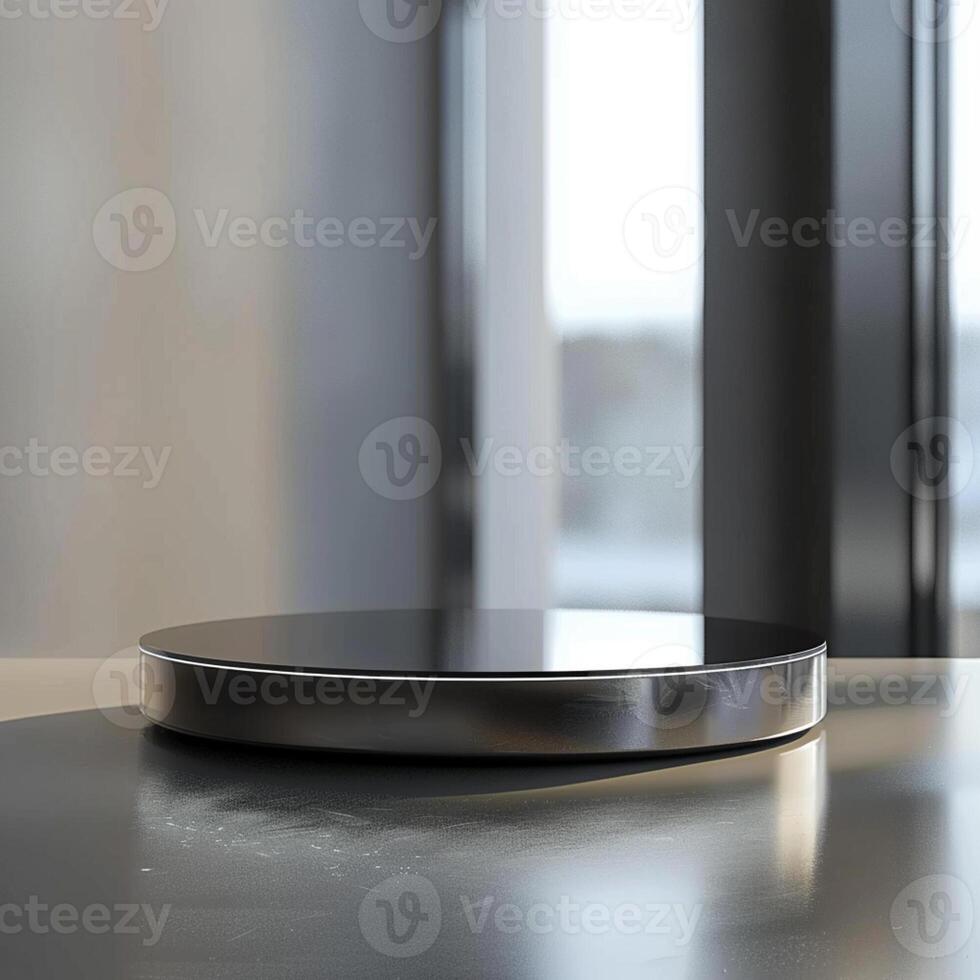A black and silver circular object on a table photo