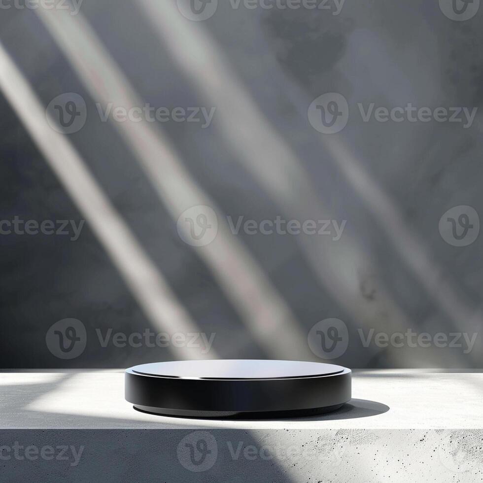 A black object sitting on a table in front of a wall photo