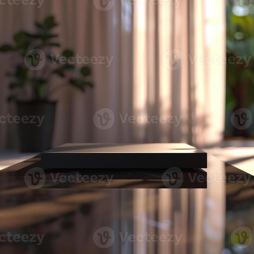 A black box sitting on a table in front of a window photo