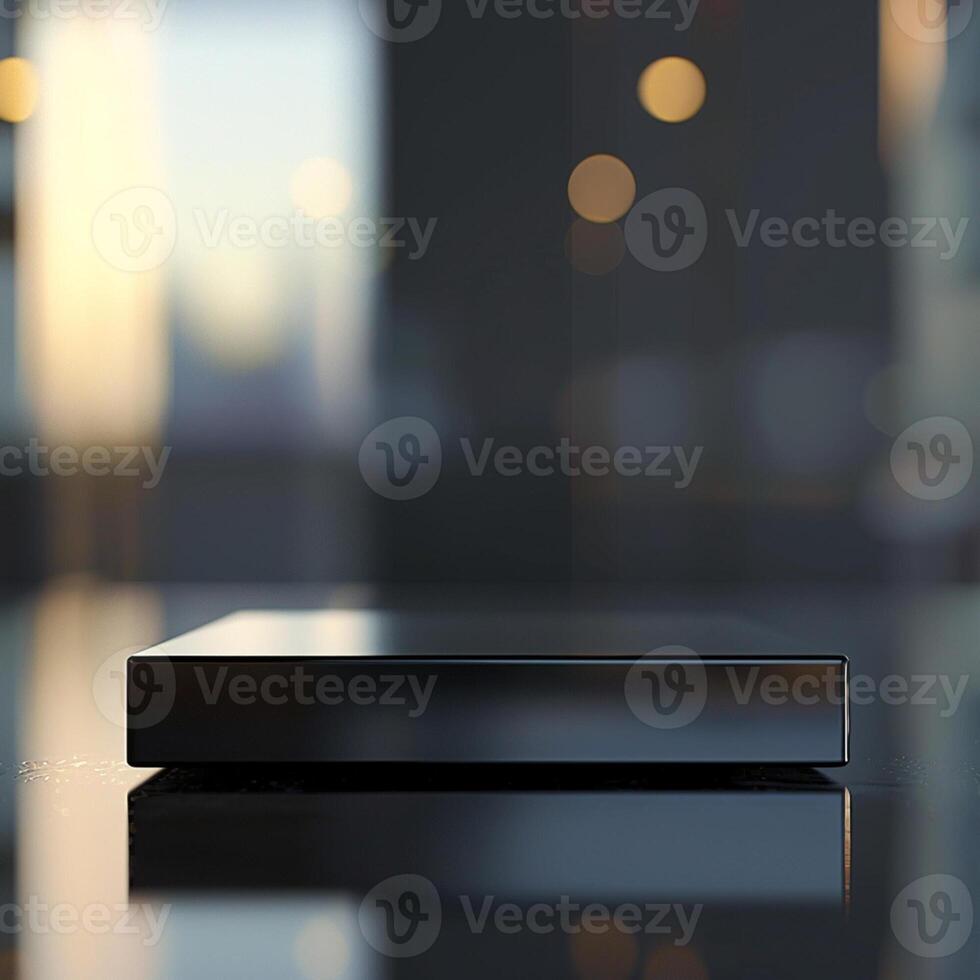 A black box sitting on a table in front of a window photo