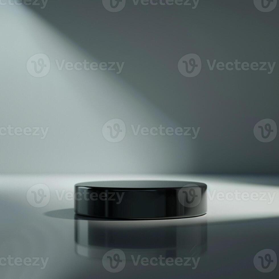 Black round table with light shining on it photo
