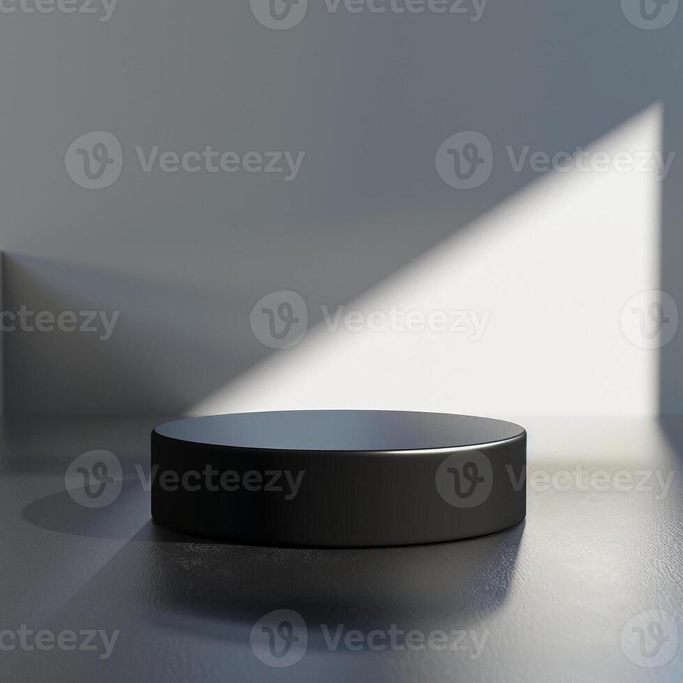 A black round object on a table in front of a wall photo