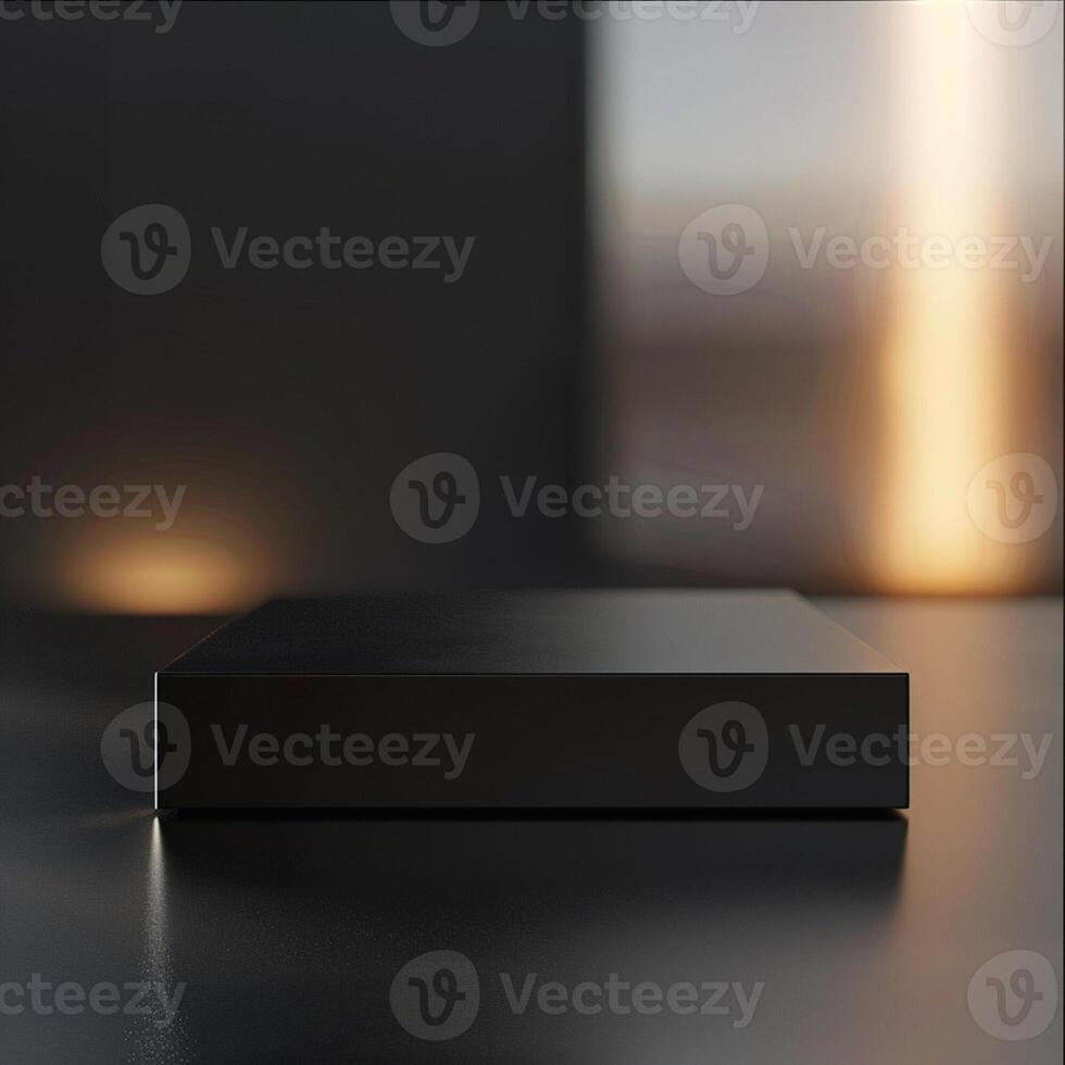 A black box sitting on a table in front of a window photo