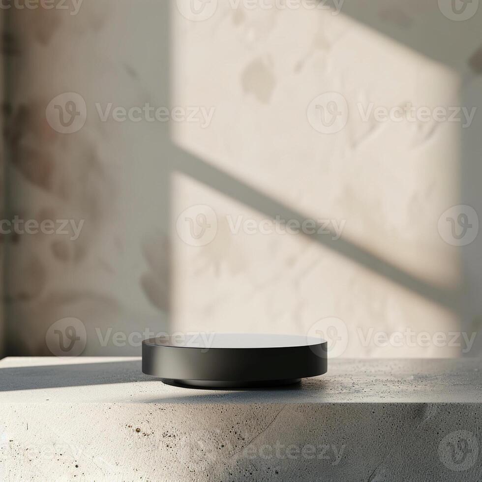 A black object sitting on a table in front of a wall photo
