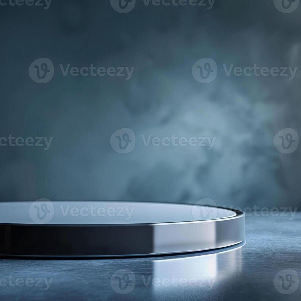 A round table with a silver top on a dark background photo