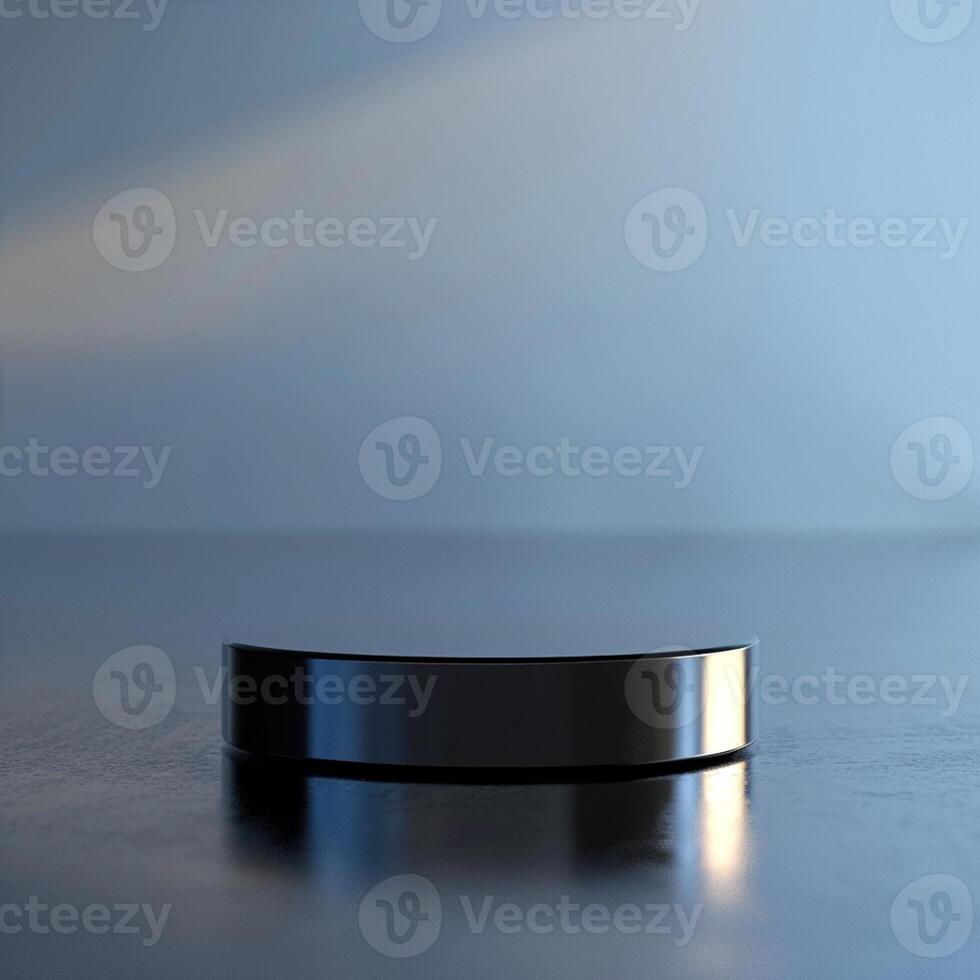 A black ring sitting on a table in front of a wall photo
