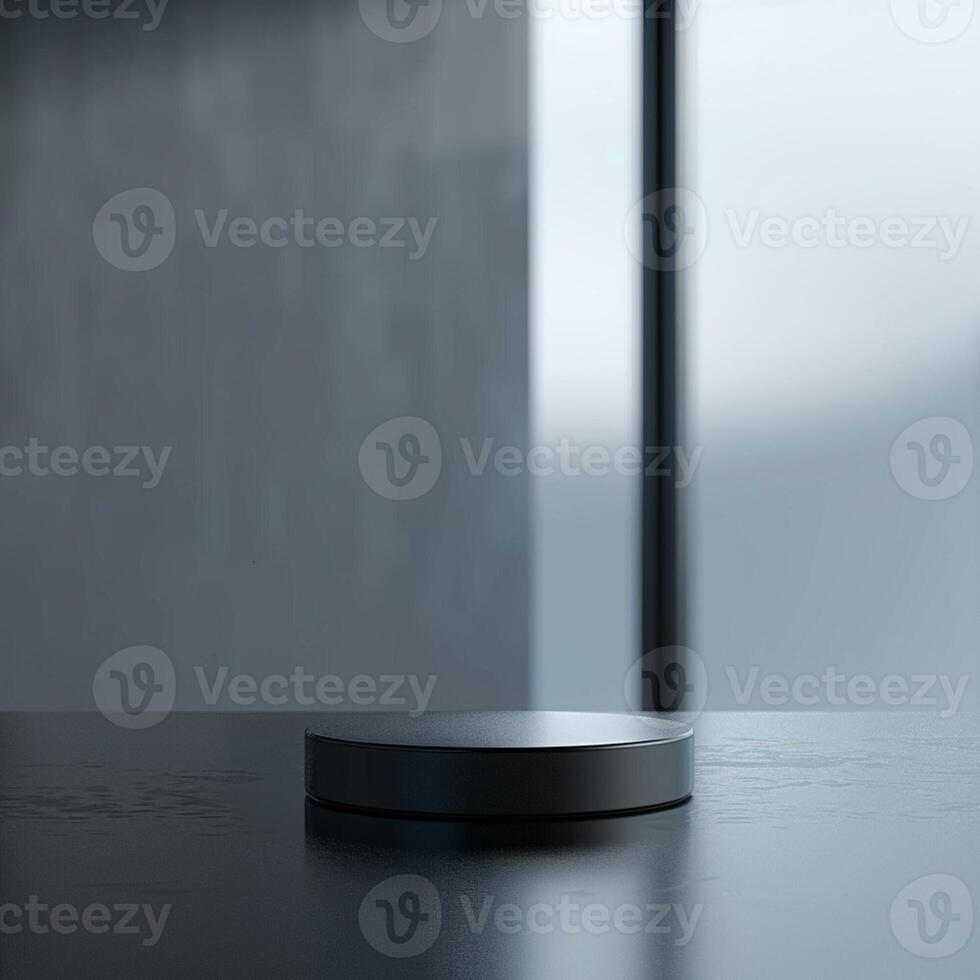 A black object sitting on a table in front of a window photo