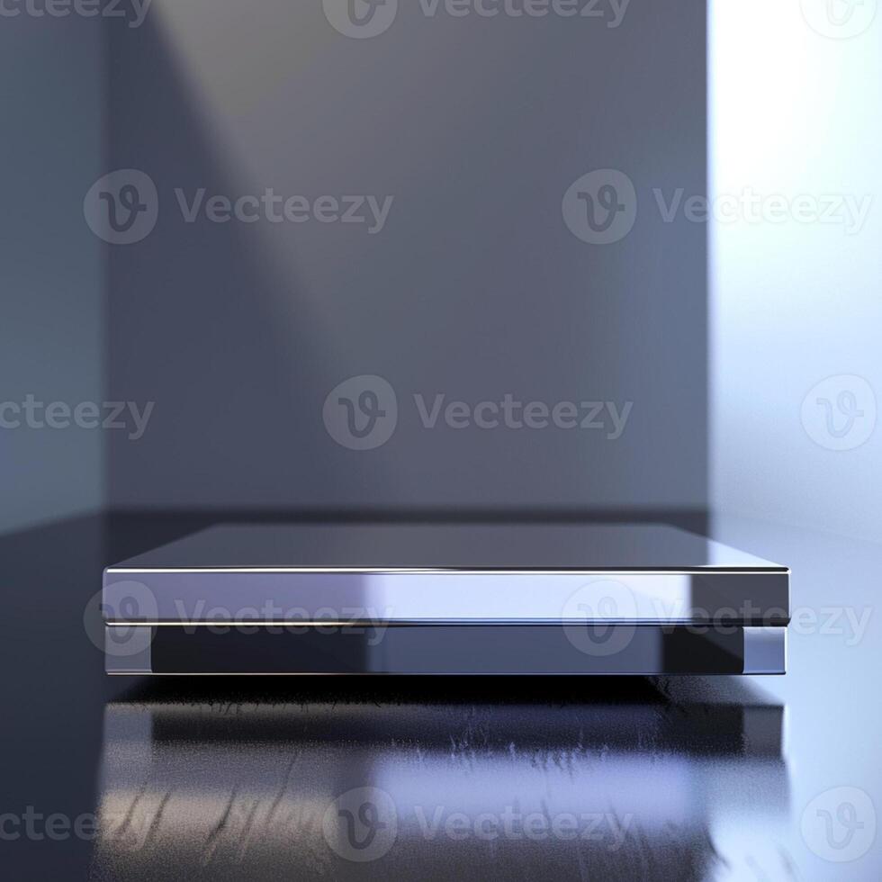 A silver box sitting on a table in front of a window photo