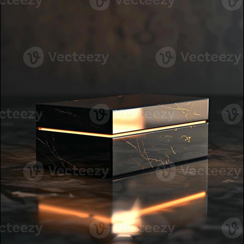 A black box with gold trim sitting on a table photo