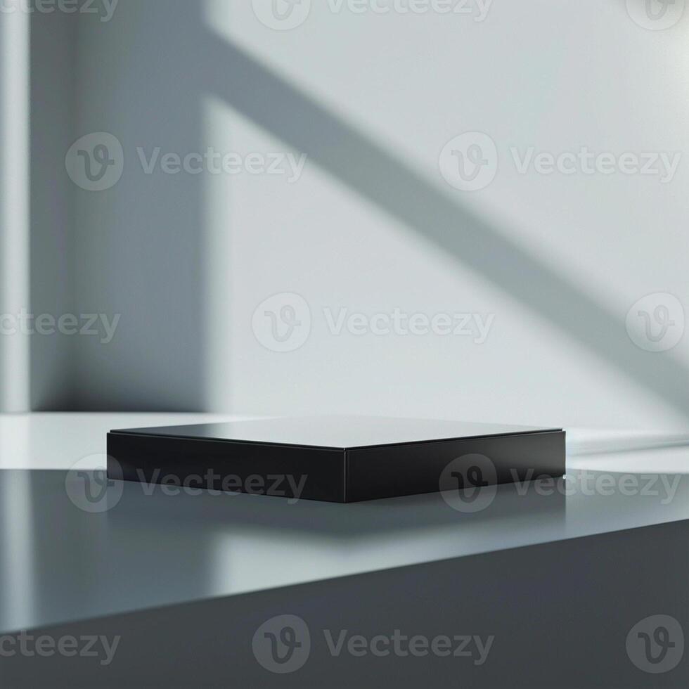 A black box sitting on a table in front of a window photo