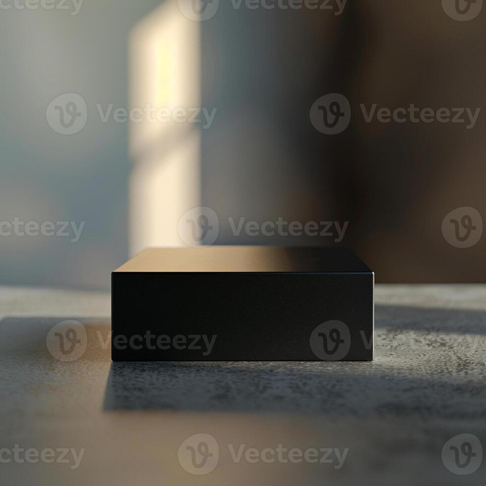 A black box sitting on a table in front of a window photo