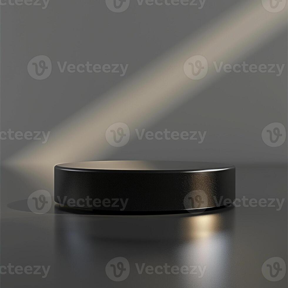 A black round object on a table with a light shining on it photo