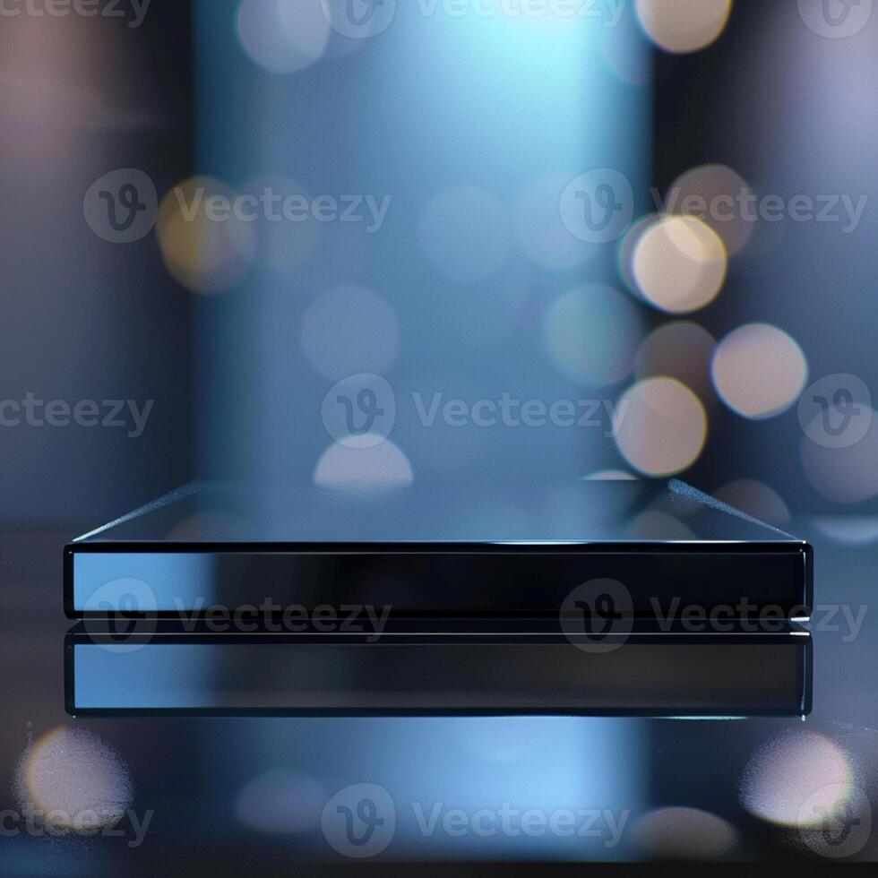 A black and silver device on a table with a bokeh effect photo