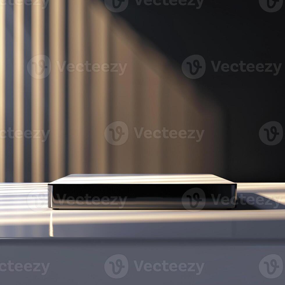A white box sitting on a table with sunlight coming through the blinds photo