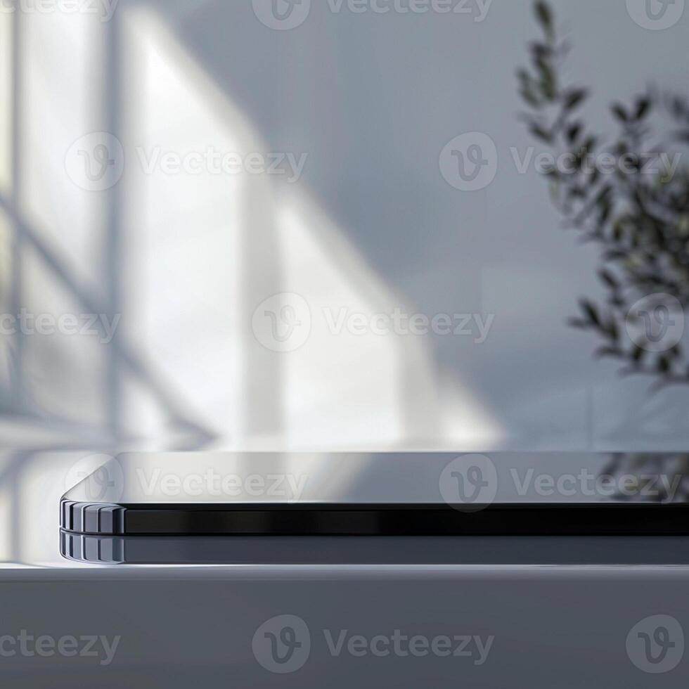 A black and white laptop sitting on a table photo