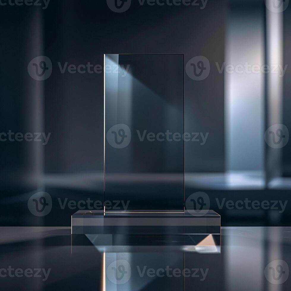 A glass award on a table in front of a dark background photo