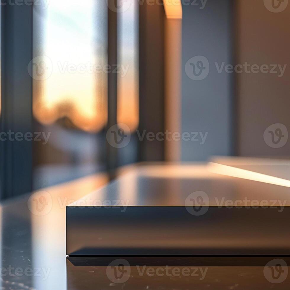 A modern kitchen counter with a window in the background photo