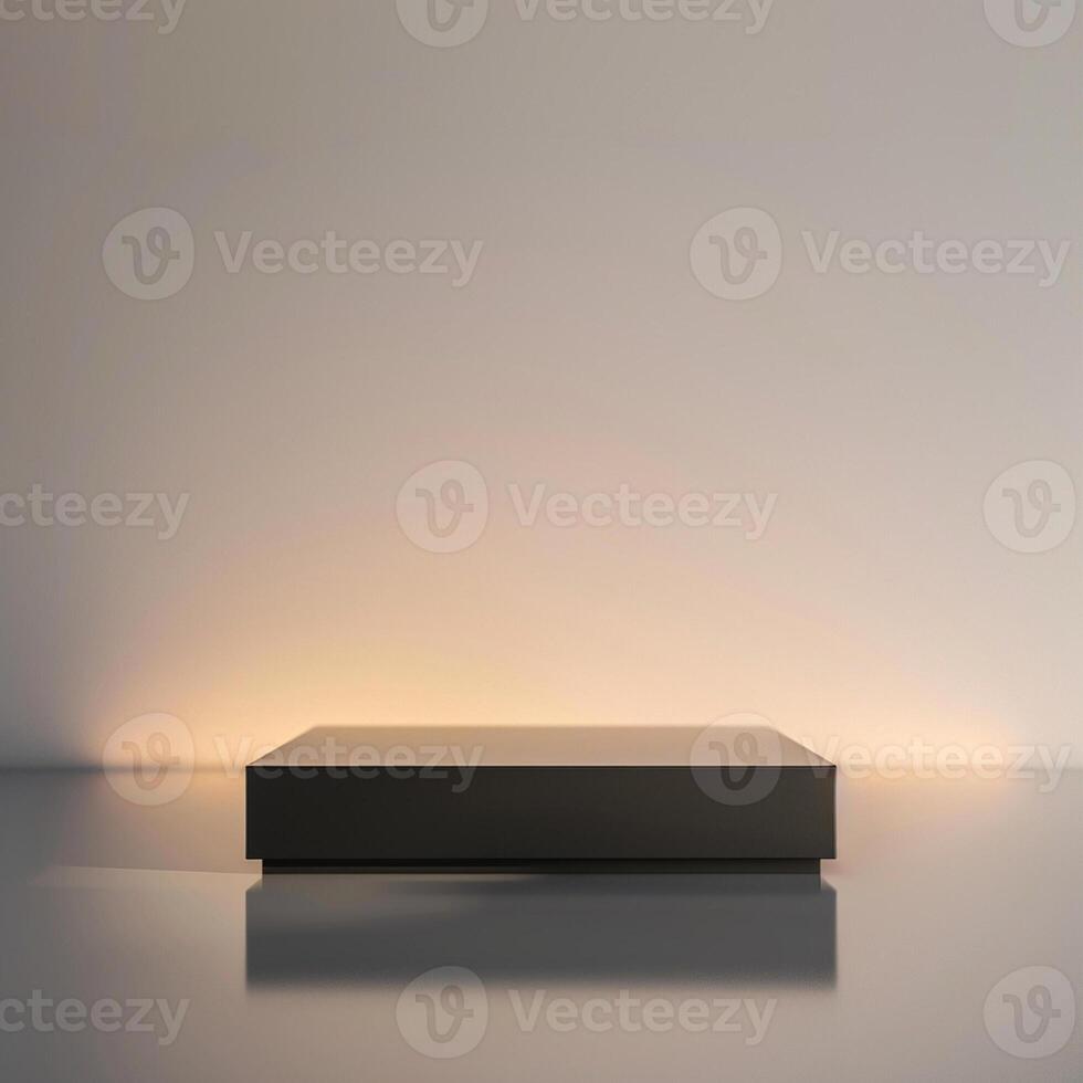 A black box sitting on a table in front of a wall photo