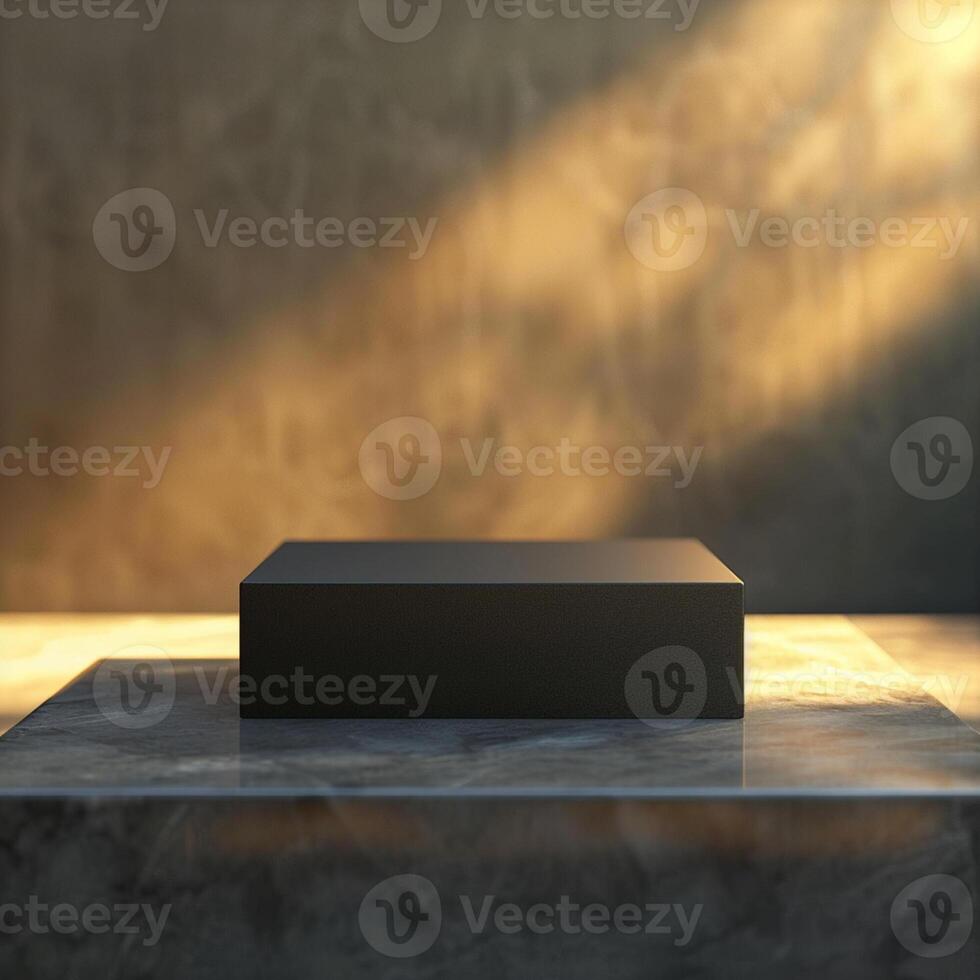 Black box on marble table with sunlight coming through photo