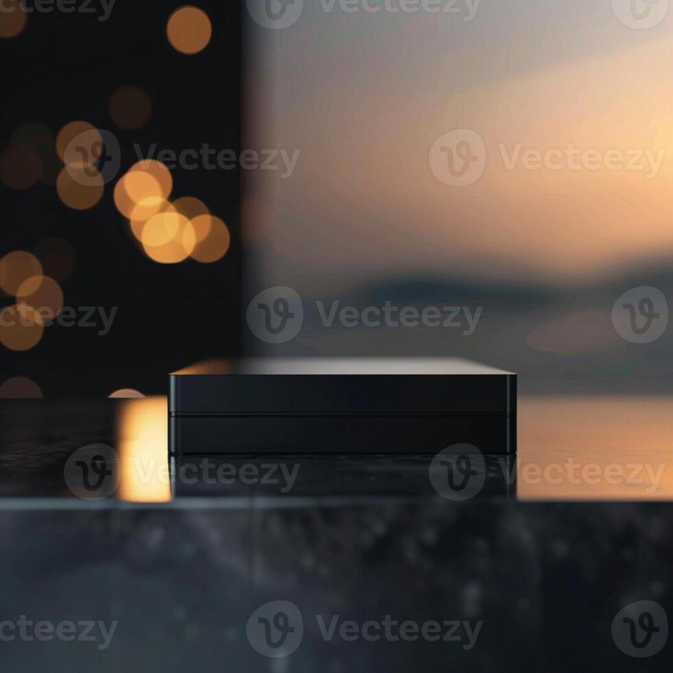 A black box sitting on a table in front of a window photo