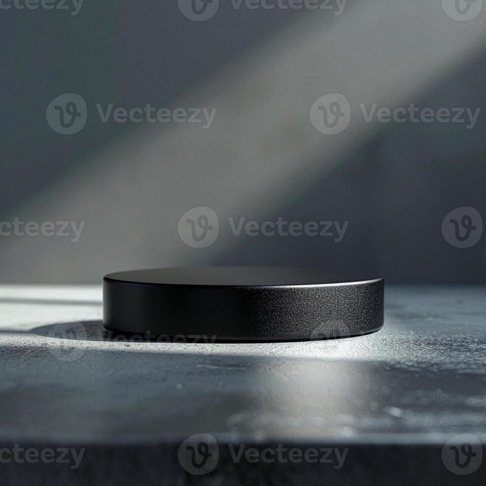 A black circular object sitting on a table photo