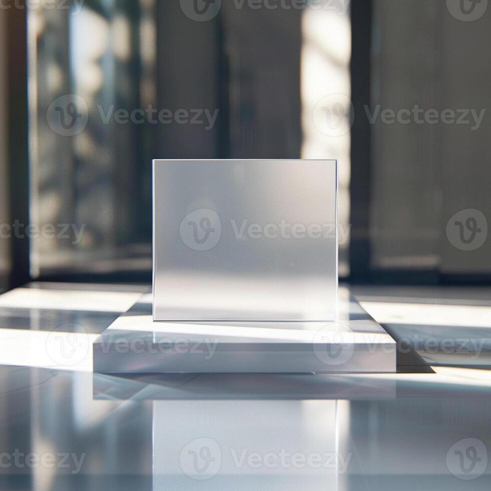 A white square on a table in front of a window photo