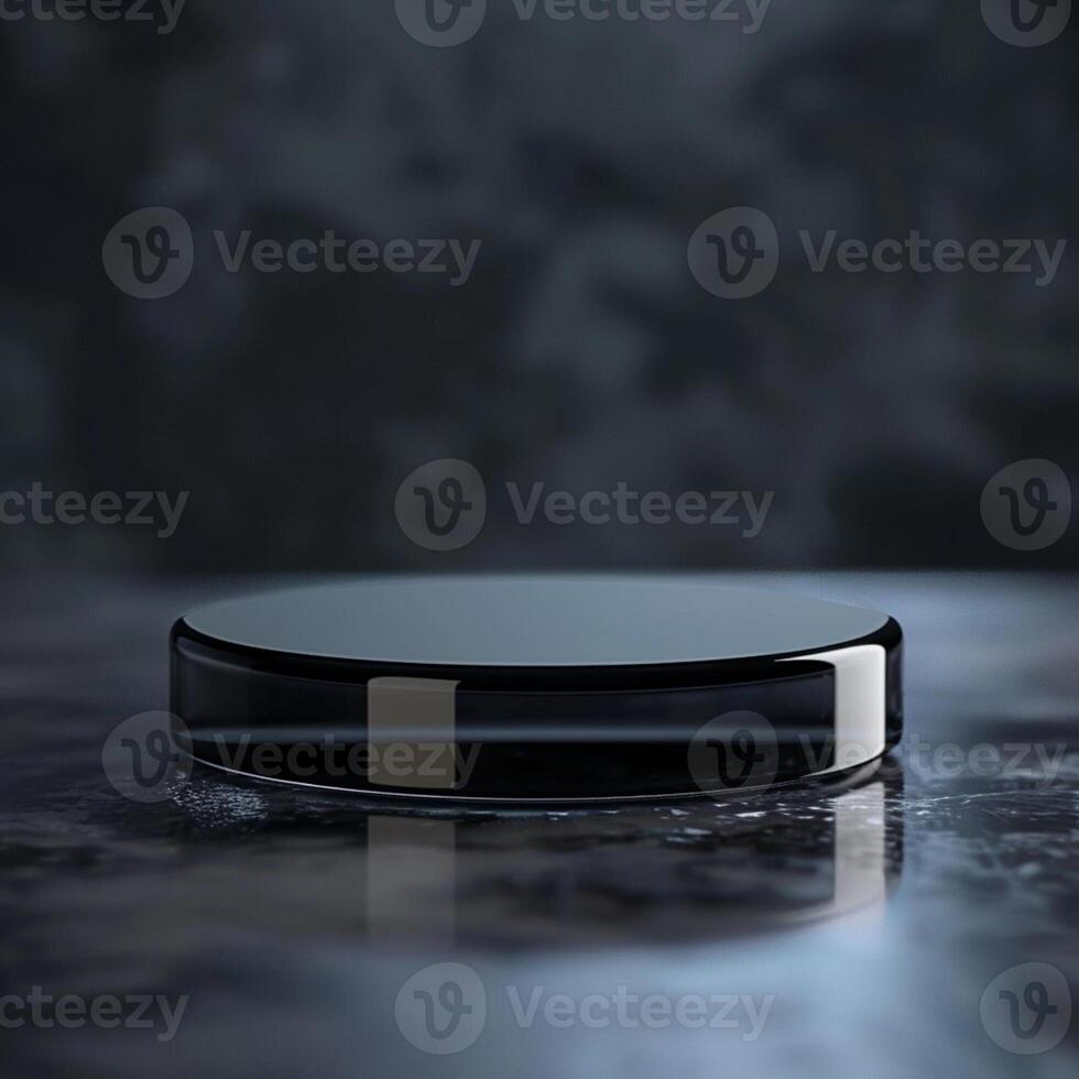 A black circular object sitting on a table photo