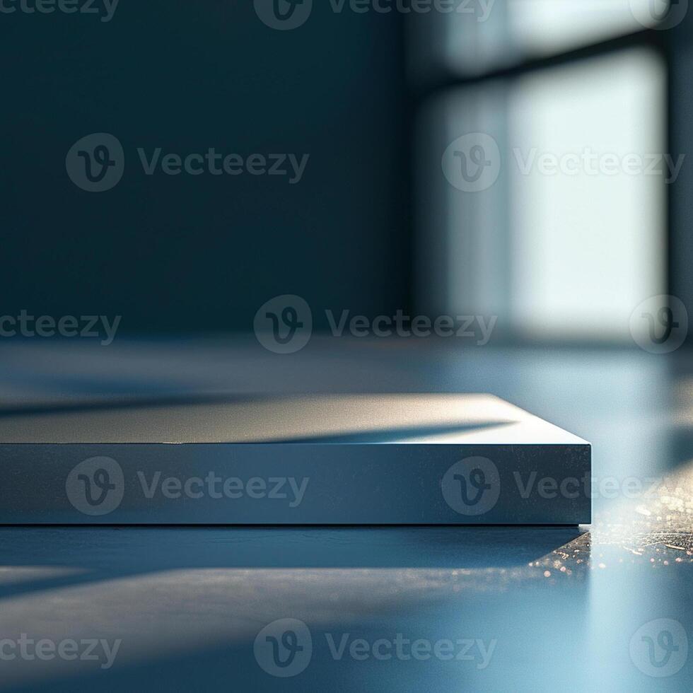 A white box sitting on a table in front of a window photo