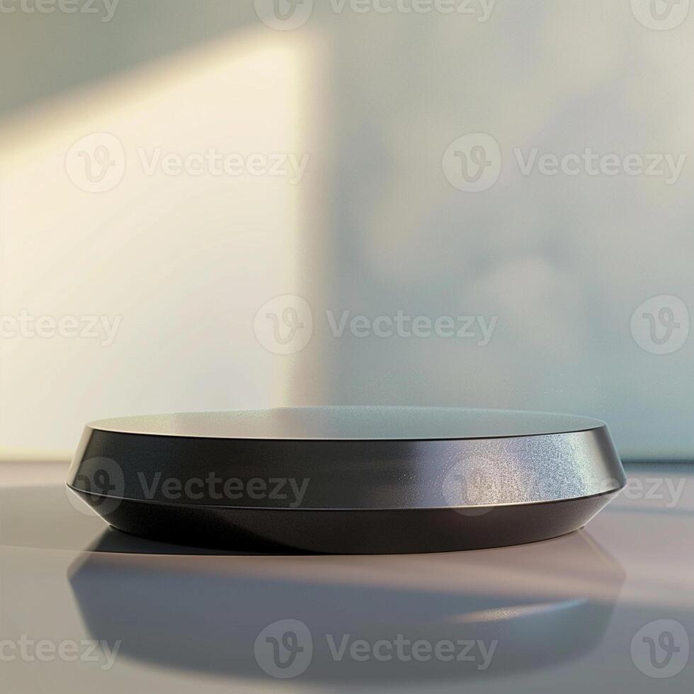 A black object on a table with a window in the background photo