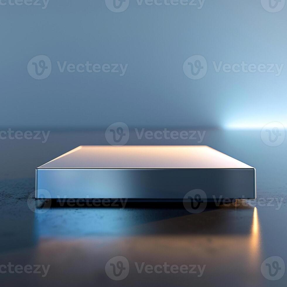 A silver box sitting on a table with a light shining on it photo