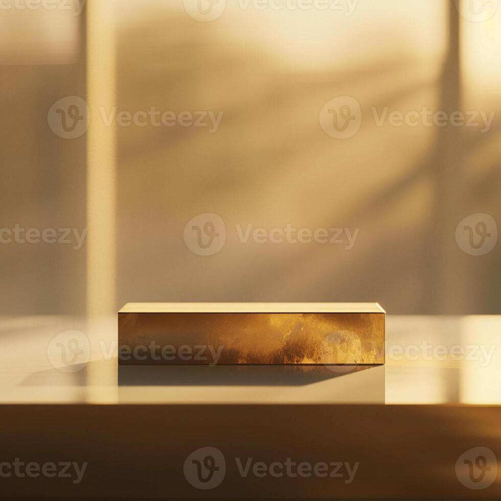 A golden box sitting on a table in front of a window photo