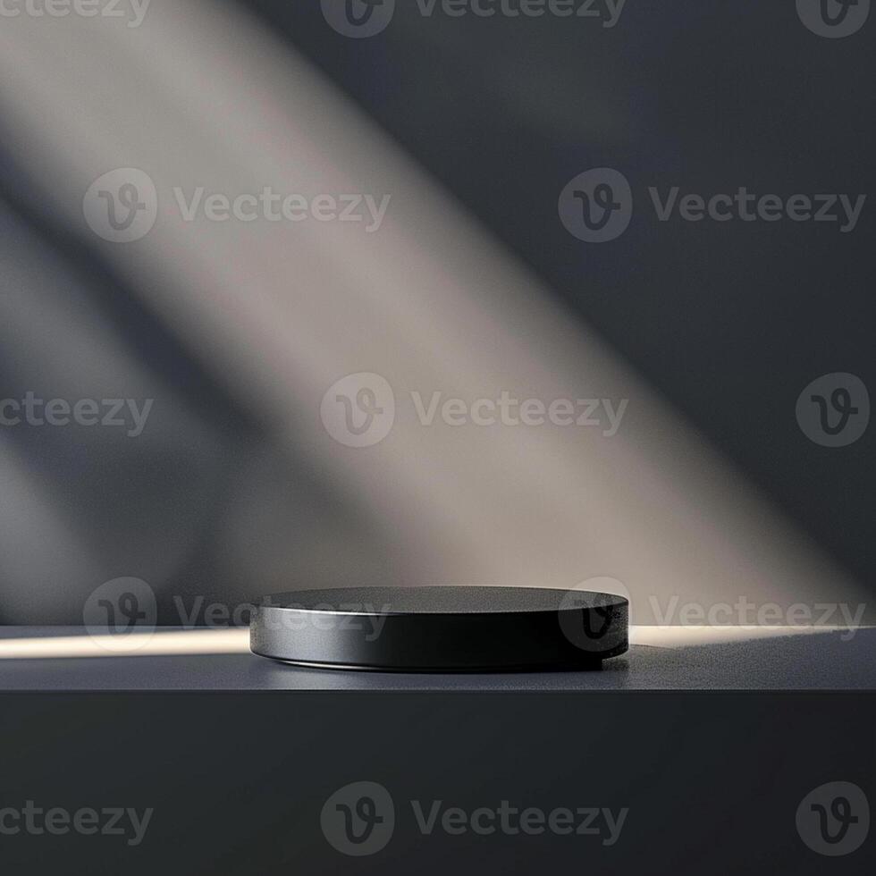 A black object on a table in front of a wall photo