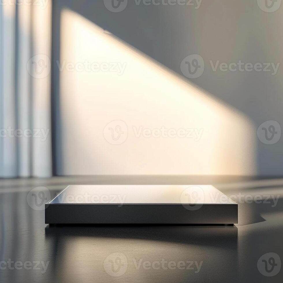 A white box sitting on a table in front of a window photo