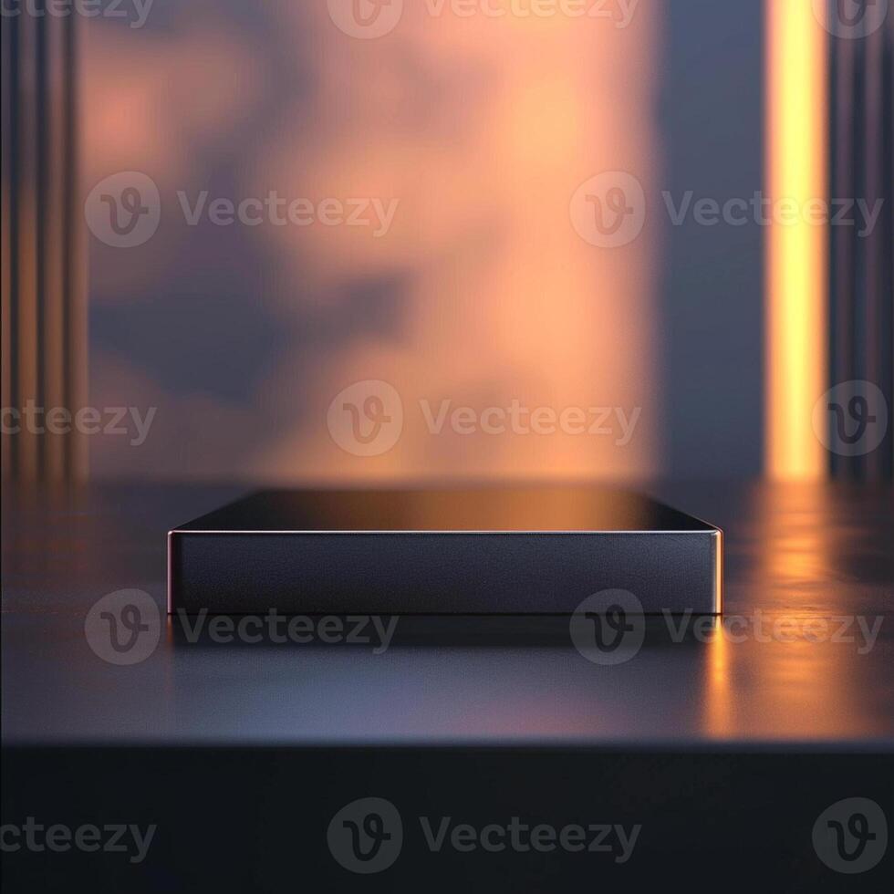 A black box sitting on a table in front of a window photo