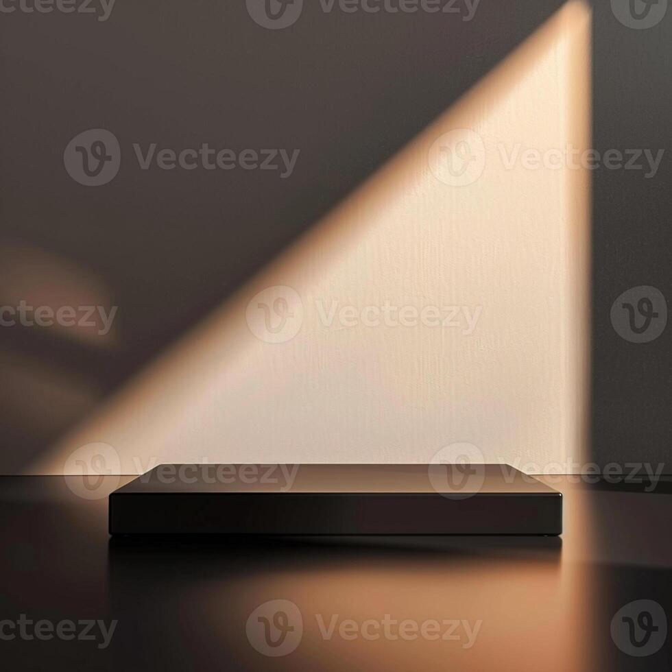 A black box sitting on a table in front of a wall photo