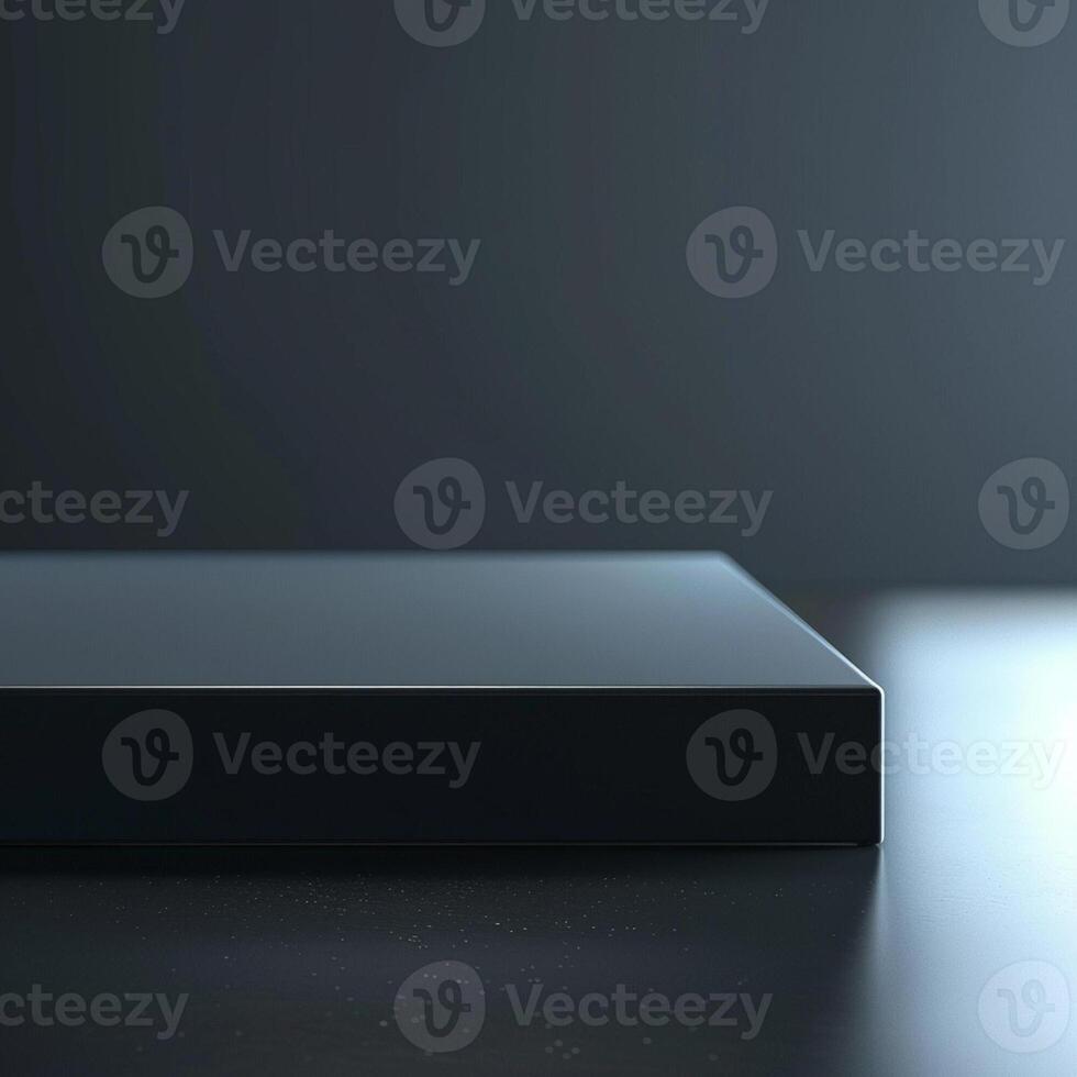 A black box sitting on a table with a light photo