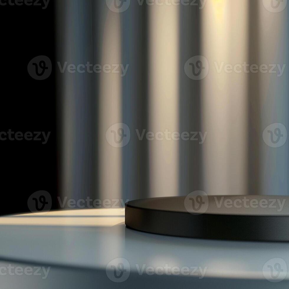 A black circular object on a table in front of a curtain photo