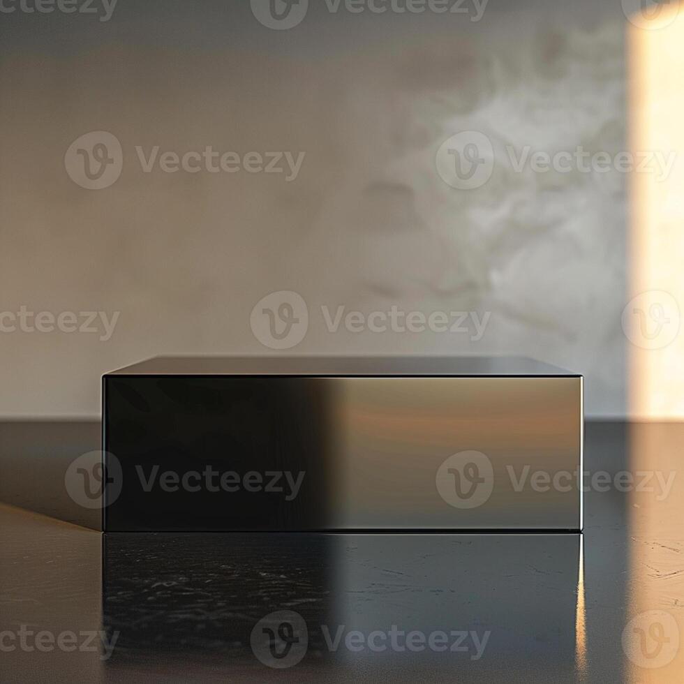 A black box sitting on a table in front of a wall photo
