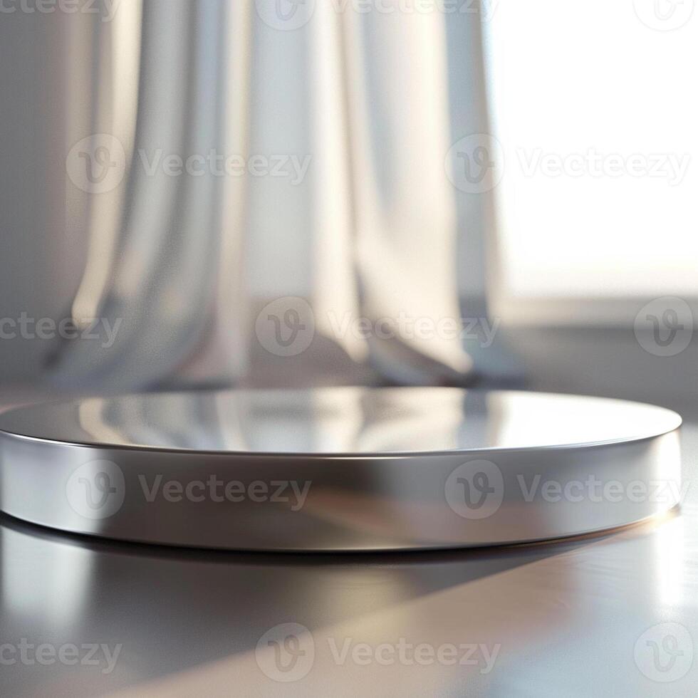 A silver plate on a table in front of a window photo