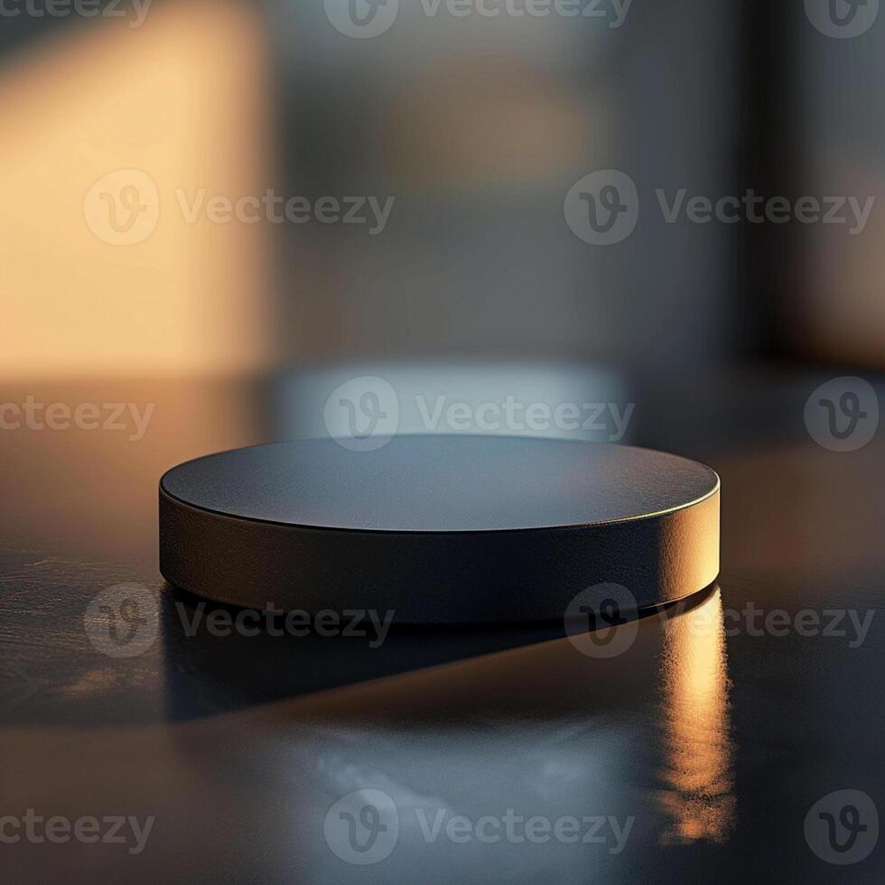 A black circular object sitting on a table photo