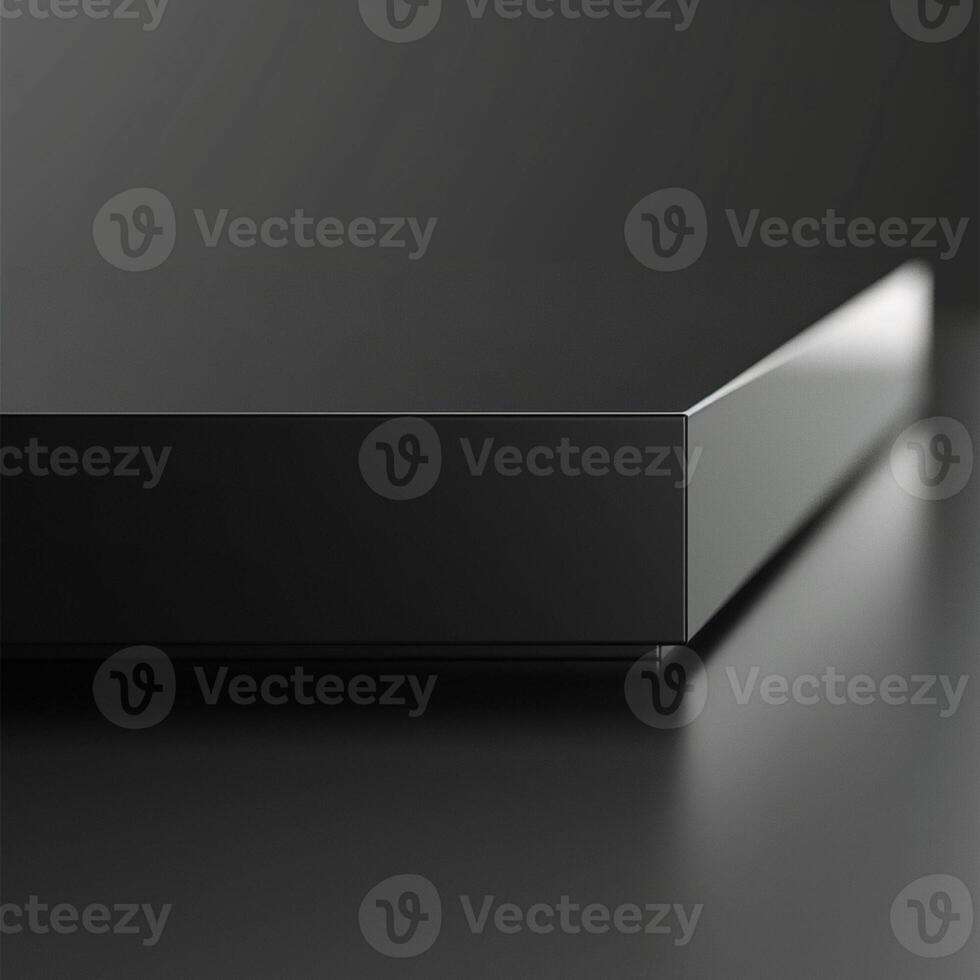 A black box with a silver surface on a table photo