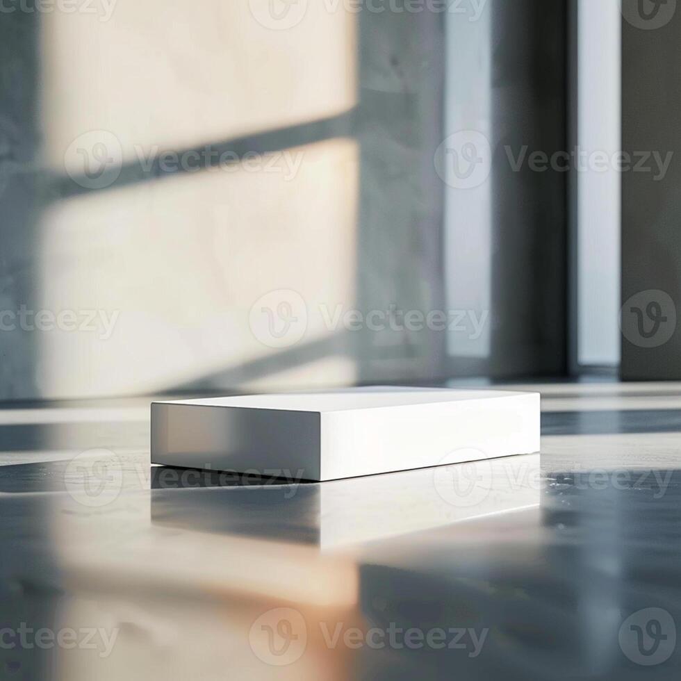 A white box sitting on a floor in front of a window photo