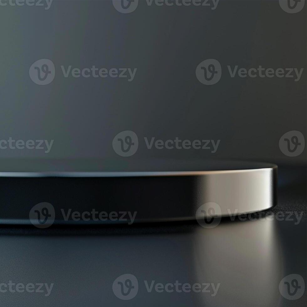 A black and silver circular object on a table photo