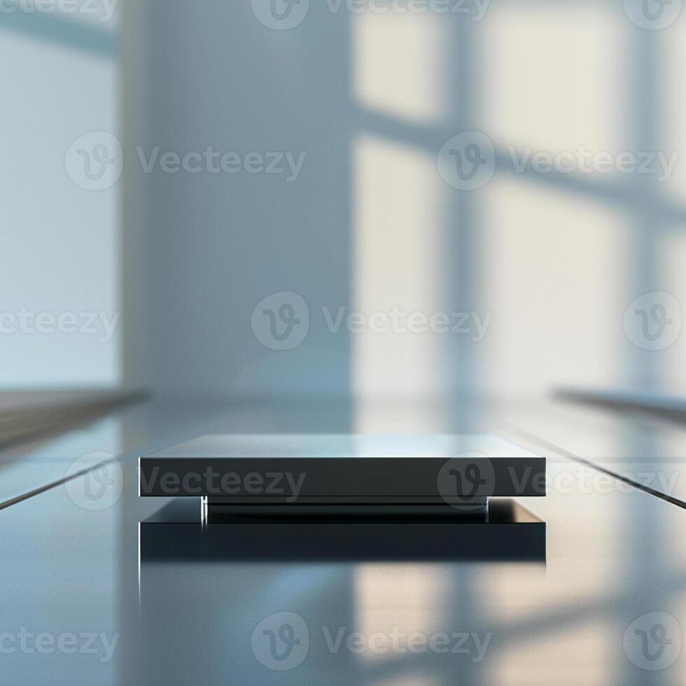 A black square on a table in front of a window photo