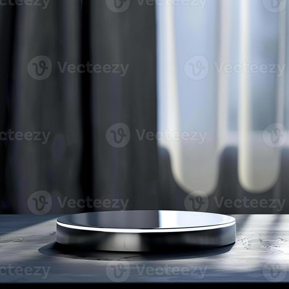 A small round object on a table in front of a window photo