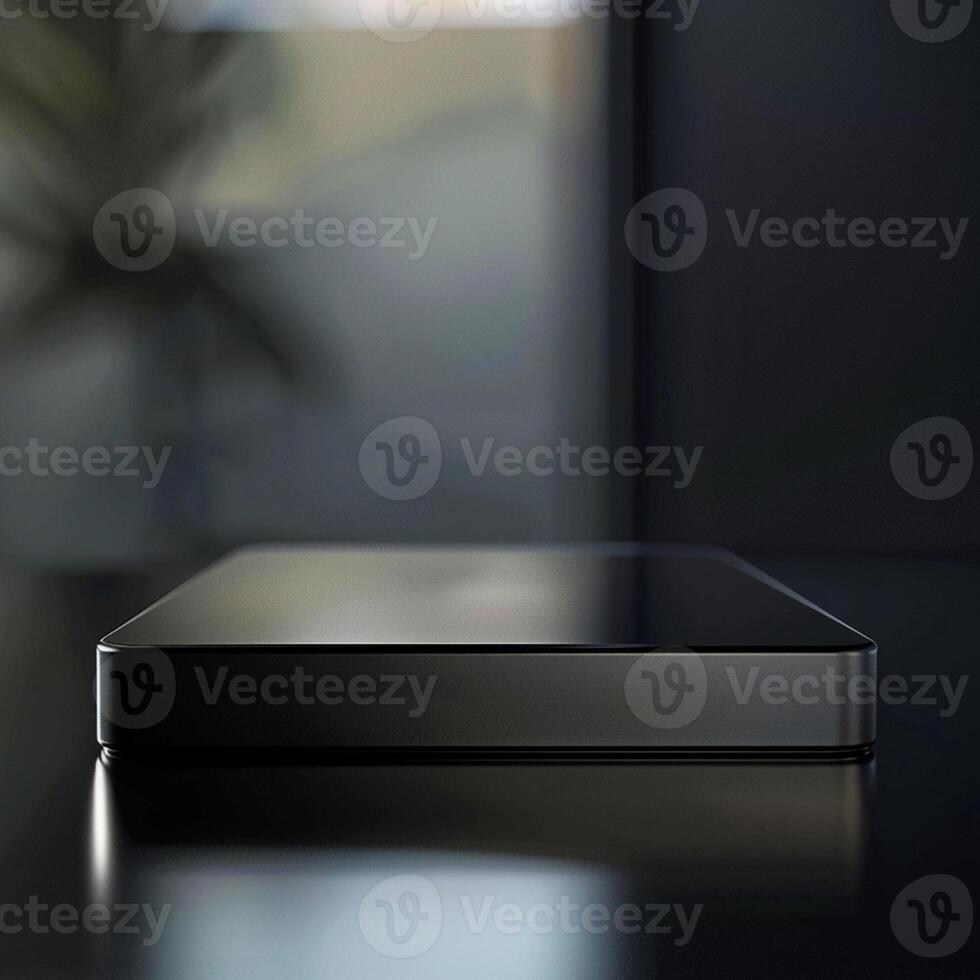A black box sitting on a table in front of a window photo