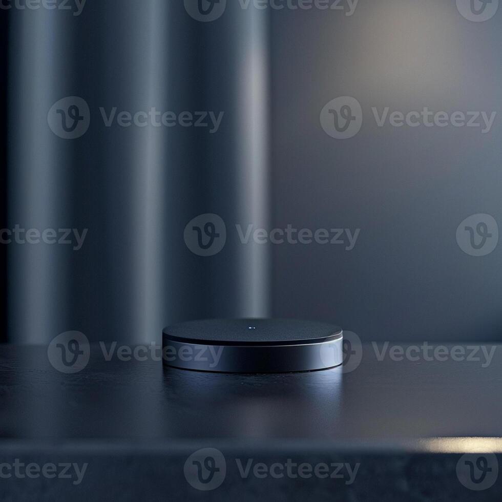 A black object sitting on a table in front of a curtain photo
