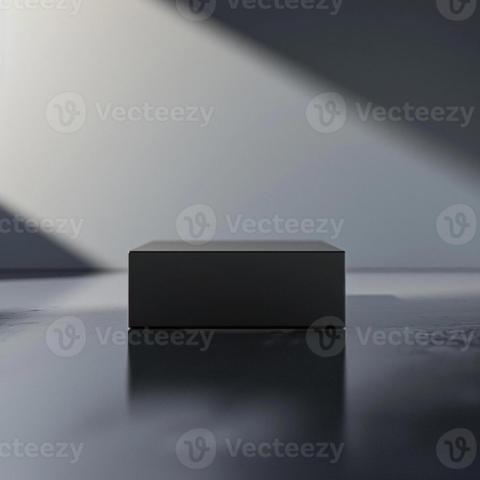 A black box sitting on a table in front of a wall photo