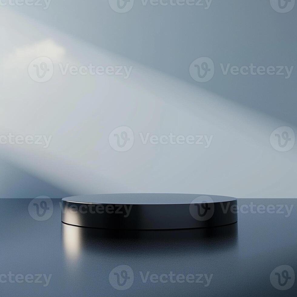 An empty black round table on a table with a light shining on it photo