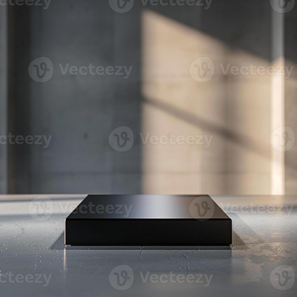 A black box sitting on a table in front of a window photo